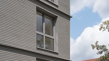 Foto des Gebäudes mit vorvergrauter Holzfassade Nahaufnahme des Gebäudes mit vorvergrauter Holzfassade